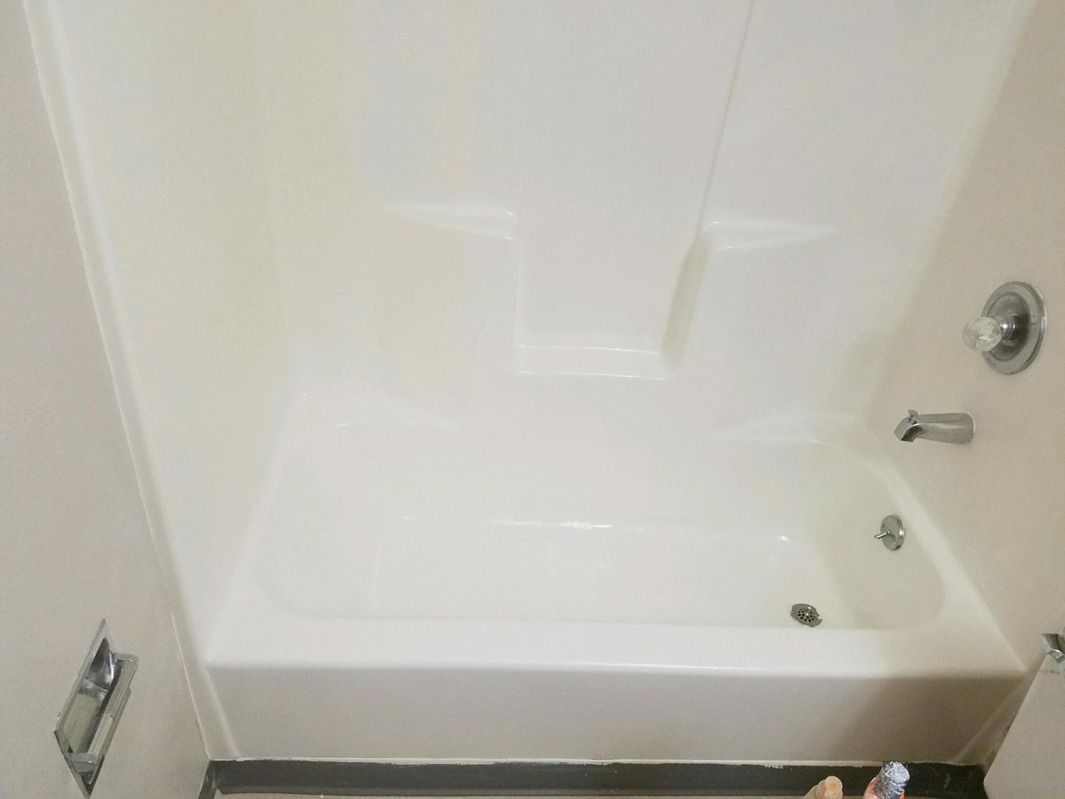 Fiberglass tub shower combo is refinished and refaced to a brand new finish