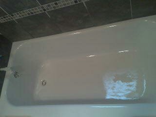 Beautiful white bathtub refinishing work by The Refinish Pro