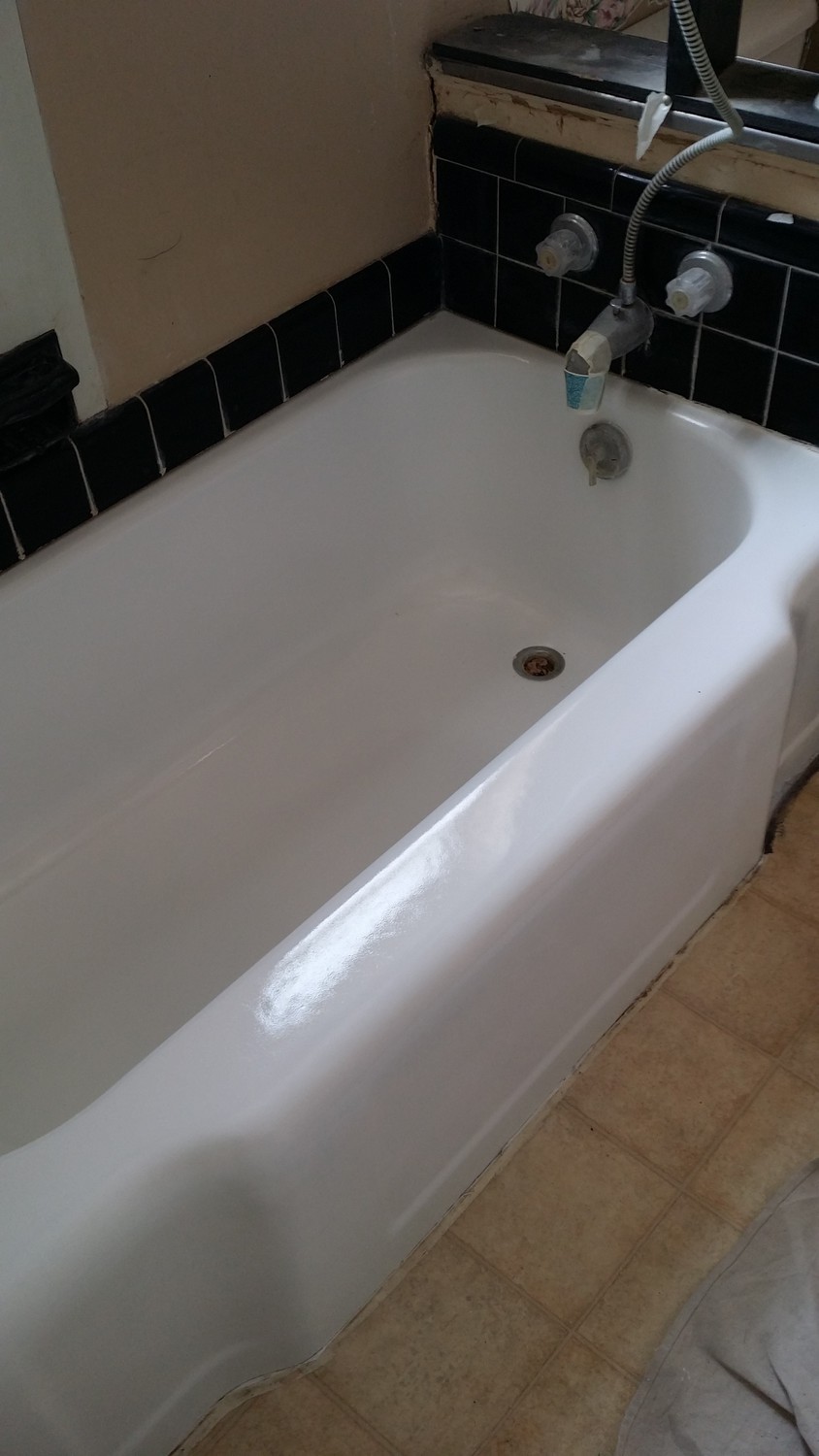 1950's cast iron bathtub repaired and refinished to a brilliant new shine and the look of new age porcelain